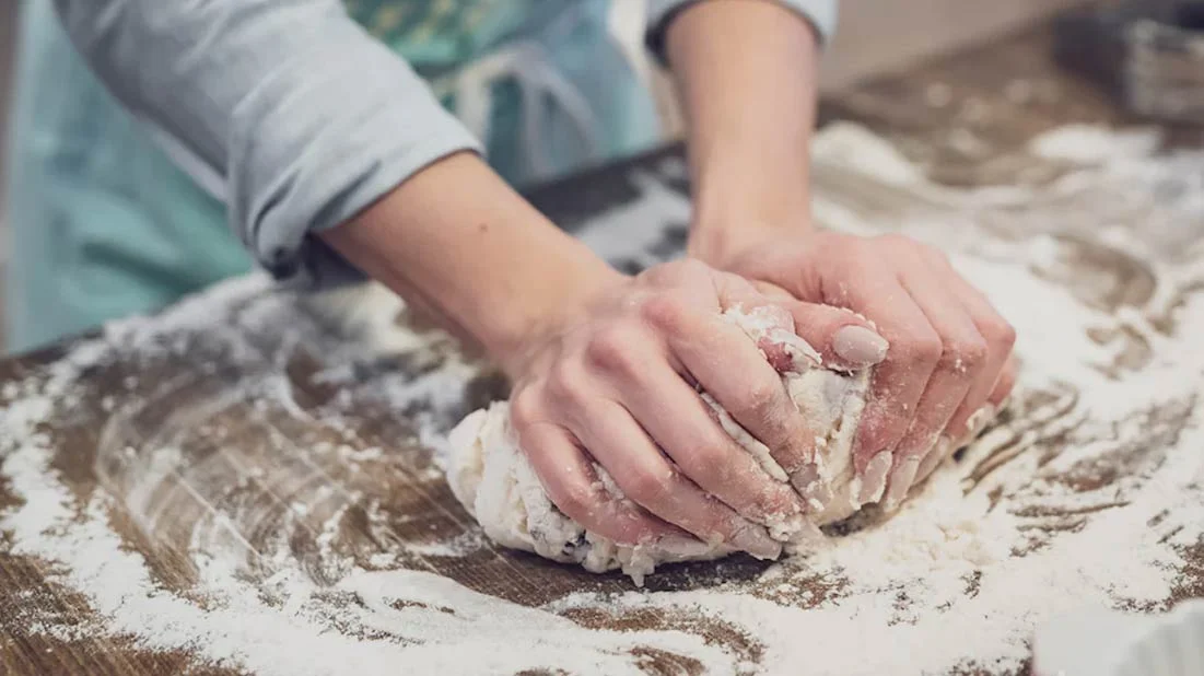 Person kneading dough